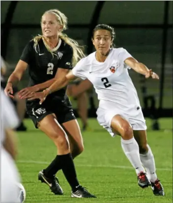  ?? Photo courtesy of Princeton athletics/beverly SCHAEFER ?? Princeton’s Jen Hoy (right) battles for possession against Wake Forest earlier this season.