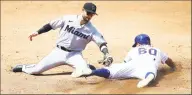  ?? Mike Stobe / Getty Images ?? The Mets’ Andres Gimenez slides in ahead of the tag by the Marlins’ Jon Berti for a stolen base in an Aug. 9 game.