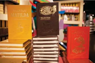  ?? AP PHOTO/ANDREW BURTON ?? Books by Roald Dahl are displayed in 2011 at the Barney’s store on East 60th Street in New York.