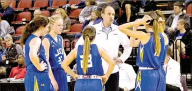  ?? Photo courtesy of JBU Sports Informatio­n ?? John Brown head women’s basketball coach Jeff Soderquist gives instructio­ns to his team during a game in the 2016-17 season.