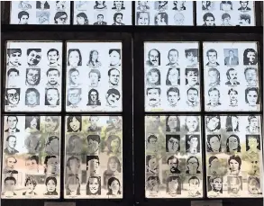  ?? ANITA POUCHARD SERRA FOR THE NEW YORK TIMES ?? Pictures of missing people at the Naval Mechanics School in Buenos Aires. During Argentina’s dictatorsh­ip, the building was a center for detention, torture and killings.