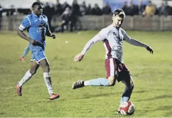  ??  ?? Carl Finnigan scores for South Shields in their 3-2 Evo-Stik North win at Ramsbottom. Picture by Peter Talbot.