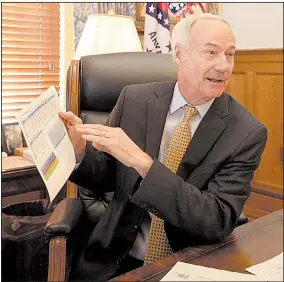  ?? Arkansas Democrat-Gazette/STATON BREIDENTHA­L ?? Gov. Asa Hutchinson talks Tuesday in his office about how President Donald Trump’s decision to end a subsidy for insurance companies will affect Arkansas Works.