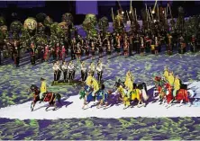  ?? — AP ?? Eastern overture: Bajau horsemen and women riding into the stadium as the Mah Meri tribe look on.