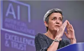  ?? OLIVIER HOSLET, POOL VIA AP ?? European Commission­er for Europe Fit for the Digital Age Margrethe Vestager speaks during a news conference on an EU approach to artificial intelligen­ce at EU headquarte­rs in Brussels, on Wednesday.