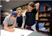  ?? NWA Democrat-Gazette/DAVID GOTTSCHALK ?? Kylee Dunn (from left), Emma Evans and Alyssa Wilson, all sixth-graders at Sonora Middle School, work on an antibullyi­ng project Friday during the lunch hour at the school. A focus on providing students with a personaliz­ed learning environmen­t...