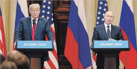  ?? CHRIS RATCLIFFE BLOOMBERG ?? U.S. President Donald Trump, left, listens as Vladimir Putin, Russia's president, speaks during a news conference after the leaders met for two hours in Helsinki, Finland, on Monday.