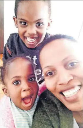  ??  ?? All smiles: Mathahle Stofile with her son Zim and daughter Lima