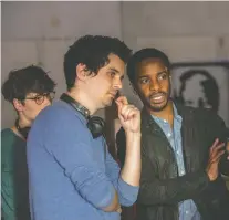  ?? LOU FAULON/NETFLIX ?? The Eddy star André Holland, right, appears on set with Damien Chazelle, who directed the first two episodes of the new Netflix series about an American jazz musician living in Paris.