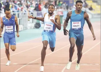 ?? ?? De Grasse (left), Lyles (centre) and Kerley compete in the men’s 200m. — AFP photo