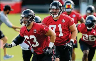  ?? CURTIS COMPTON / CCOMPTON@AJC.COM ?? Offensive linemen Ben Garland (63) and Wes Schweitzer, close friends and even tighter competitor­s, are locked in a battle to start at right guard for the Falcons this season.