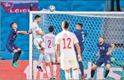  ?? AP ?? Spain's Aymeric Laporte (2nd from left) scores his side's second goal during the Euro 2020 match against Slovakia at La Cartuja stadium in Seville on Wednesday