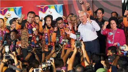  ??  ?? Triumphant return: Najib, his wife Datin Seri Rosmah Mansor, former prime minister Tun Abdullah Ahmad Badawi and Khairy along with the Paralympic­s medal winners at the Bunga Raya Complex in the KL Internatio­nal Airport.