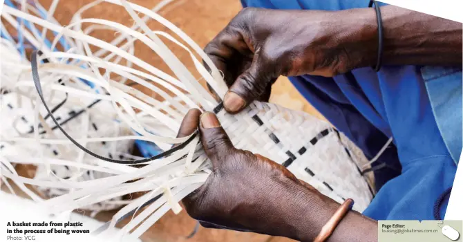  ?? Photo: VCG loukang@globaltime­s.com.cn ?? A basket made from plastic in the process of being woven
Page Editor: