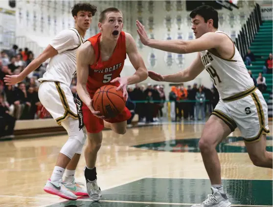  ?? ALLEN CUNNINGHAM/SUN-TIMES ?? Libertyvil­le senior Will Buchert is fouled while taking the ball to the basket Saturday against Stevenson. He scored 20 points.