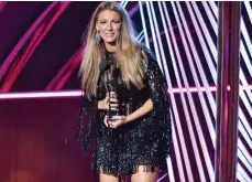  ??  ?? Blake Lively turned up in a shimmering Elie Saab outfit as she picked up the Favourite Dramatic Movie Actress trophy.