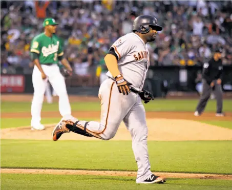  ?? Photos by D. Ross Cameron / Special to The Chronicle ?? Pablo Sandoval’s seventh-inning homer knocked Edwin Jackson (background) from the game, giving San Francisco a 3-1 lead.