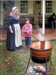  ?? SUBMITTED PHOTOS ?? Pottsgrove Manor presents ‘An Apple a Day, the Colonial Wayí Oct. 22. Shown here is a demonstrat­ion of making apple butter.