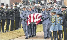  ??  ?? The honor guard salutes the escort passing by with Georgia Southweste­rn State University campus police officer Jody Smith at the conclusion of his funeral service Wednesday. Smith was the seventh law enforcemen­t officer shot and killed in Georgia this...