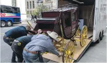  ?? DAVE SIDAWAY ?? A two-thirds scale model used by Buffalo Bill based on the stagecoach­es built by Wells Fargo for use in the 1860s is wheeled into the Montreal Museum of Fine Arts.