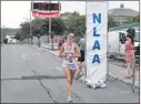  ?? TELEGRAM FILE PHOTO ?? Lisa Collins-sheppard finished second in the 2013 Tely 10 to winner Lisa Harvey of Calgary. Art Meaney says Collins-sheppard will finish fourth this year.