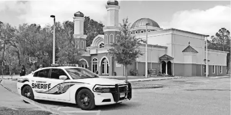  ?? JAMES BORCHUCK, THE TAMPA BAY TIMES, VIA AP ?? The response to an arson last month at the Islamic Society of New Tampa is the latest gesture of goodwill between Muslims and Jews.