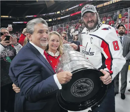  ?? BRUCE BENNETT/GETTY IMAGES ?? Washington Capitals owner Ted Leonsis holds the big prize along with Alex Ovechkin after winning the 2018 Stanley Cup. “I liken sports betting more to Wall Street ... I don’t believe it’ll be considered a game of chance,” says Leonsis, who owns seven pro sports teams.