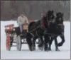  ?? LAUREN HALLIGAN — DIGITAL FIRST MEDIA FILE ?? Representa­tives from the Washington County Draft Animal Associatio­n take passengers on horsedrawn rides around the park grounds at the 2018 Winterfest at Hudson Crossing Park.