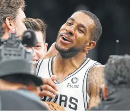  ?? Tom Reel / Staff photograph­er ?? LaMarcus Aldridge is congratula­ted on his career-high 56 points. He got 42 after the half, and the Spurs needed all of them to survive Thursday’s double-OT thriller.