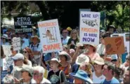  ?? TANIA BARRICKLO — DAILY FREEMAN ?? Many protesters carried hand-made signs to express their outrage of Trump’s immigratio­n policy.