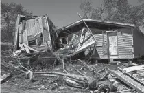  ?? EMILY ELCONIN/ REUTERS ?? A mobile home destroyed by a tornado that also severely damaged and destroyed several other homes is seen Wednesday in Kalamazoo, Mich.