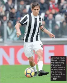  ?? — AFP ?? Juventus’ Paulo Dybala controls the ball during the Serie A match Juventus vs Benevento at the Juventus Stadium in Turin on Sunday.