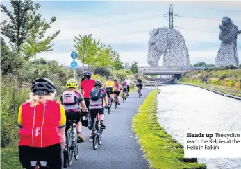  ??  ?? Heads up The cyclists reach the Kelpies at the Helix in Falkirk