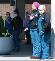  ?? PHOTO BY RICK MARTIN ?? Workers at Pottstown Hospital took a break Wednesday afternoon to take in a drive-by parade thanking them for their efforts.