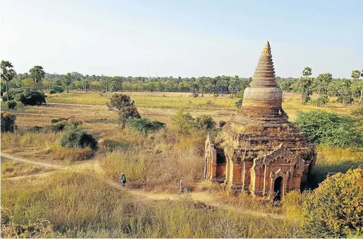  ?? RICHARD HOLMES ?? TRAINING DAY: (clockwise from left) A new, Chinese-made locomotive pulls the ageing rolling stock into Bagan station; one of the 2 000 pagodas dotted across the plains of Bagan; and Craig Holmes, an English teacher in Yangon, gets comfortabl­e in a...