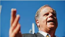  ?? Brynn Anderson / Associated Press ?? Democratic Senate candidate Doug Jones addresses the media Tuesday in Birmingham, Ala. A victory by Jones against Roy Moore would cut the GOP Senate majority to 51-49.