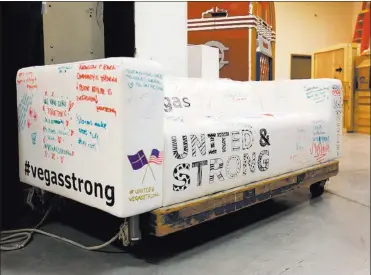 ??  ?? A couch from Ikea bearing positive messages is seen Sept. 5 at Nevada State Museum.
