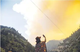  ?? AP PHOTO ?? RAGING INFERNO
Fire burns along Highway 70 in Plumas National Forest, California on July 16, 2021 (July 17 in Manila).