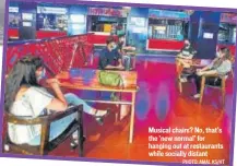  ?? PHOTO: AMAL KS/HT ?? Musical chairs? No, that’s the ‘new normal’ for hanging out at restaurant­s while socially distant