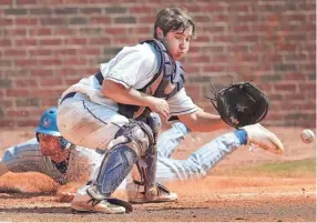  ??  ?? Christian Brothers catcher Chris Marable tries to make the play at home while John Bolton from MUS slides in safe. JIM WEBER/THE COMMERCIAL APPEAL