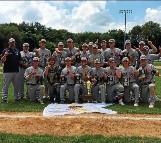  ?? THOMAS NASH — DIGITAL FIRST MEDIA ?? Members of the Spring City American Legion baseball team gather with the trophy after winning the Pa. State Tournament Championsh­ip on Wednesday afternoon at Bear Stadium. The Red Sox beat Souderton 6-1 for their first State Tournament title since 2010.