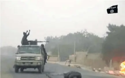  ?? /AFP ?? A video released by Islamist group Boko Haram shows Boko Haram fighters during a Christmas Day attack on a military checkpoint in the northeast Nigerian city of Maiduguri.