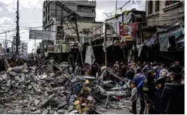  ?? FATIMA SHBAIR / AP ?? Palestinia­ns check destructio­n after an Israeli strike in Rafah, Gaza Strip, on Monday. Gaza’s Health Ministry says 30,631 Palestinia­ns have died in the war.