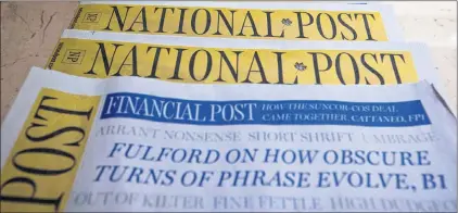  ?? CP PHOTO ?? Copies of the Postmedia-owned newspaper National Post are displayed at a hotel in Burnaby, B.C., on Jan. 19, 2016. Torstar Corp. and Postmedia Network Inc. have signed a deal that will see the companies swap a number of community and daily newspapers.