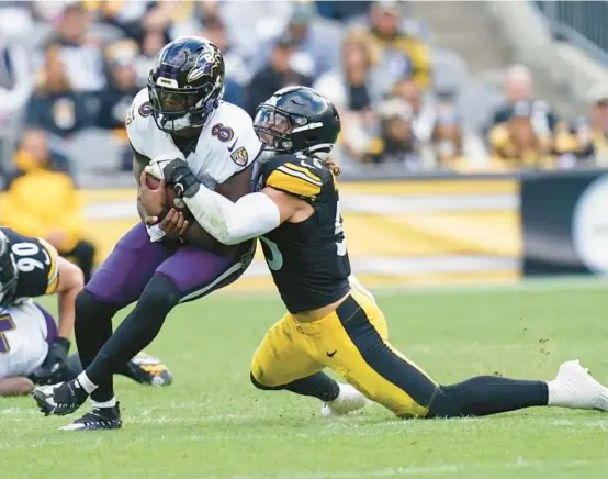  ?? MATT FREED/AP ?? Steelers linebacker Cole Holcomb sacks Ravens quarterbac­k Lamar Jackson during Pittsburgh’s 17-10 win Oct. 8.