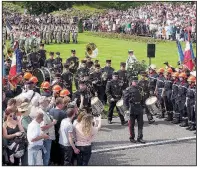  ?? A French military band commemorat­es Memorial Day at the Aisne-Marne American Cemetery near Chateau-Thierry, France. This year marked the first time German army units were invited to attend the ceremony. ??