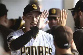  ?? DENIS POROY — GETTY IMAGES ?? Pitcher Blake Snell, then with the San Diego Padres, is congratula­ted after pitching in the seventh inning against the Tampa Bay Rays at Petco Park on June 17, 2023, in San Diego.