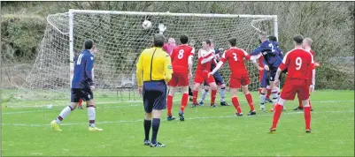  ??  ?? David McArthur, No 2, out-jumps the Rolls Royce defence to head Saints into the lead during last Saturday’s match at Glencruitt­en.