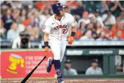  ?? AP Photo/David J. Phillip ?? ■ Houston Astros' Michael Brantley watches his two-run single against the Seattle Mariners Wednesday during the second inning of a baseball game in Houston.