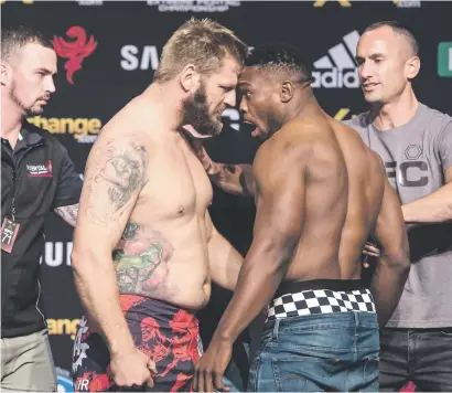  ?? Picture: EFCWorldwi­de ?? READY FOR ACTION. A fired-up heavyweigh­t champion Andrew van Zyl faces off with Dalcha Lungiambul­a during the weigh-in for EFC71 at Carnival City yesterday.
